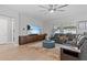 Spacious living room featuring a large TV and comfortable seating at 31921 Magna Gulf Loop, San Antonio, FL 33576