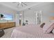 Comfortable main bedroom with a TV, ensuite bathroom, and spacious closet at 31921 Magna Gulf Loop, San Antonio, FL 33576
