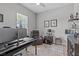 Comfortable office space with modern desk, chair, and a relaxing recliner at 31921 Magna Gulf Loop, San Antonio, FL 33576