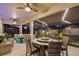 Inviting screened-in patio with ample seating and ceiling fans, perfect for entertaining or relaxing at 31921 Magna Gulf Loop, San Antonio, FL 33576