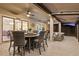 Inviting screened-in patio with ample seating and ceiling fans, perfect for entertaining or relaxing at 31921 Magna Gulf Loop, San Antonio, FL 33576