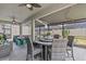Inviting outdoor patio with a screened-in enclosure, comfortable seating, and a dining area for entertaining at 31921 Magna Gulf Loop, San Antonio, FL 33576