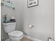 Cozy powder room with toilet, modern fixtures and decor at 31921 Magna Gulf Loop, San Antonio, FL 33576