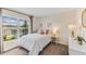 Charming bedroom with carpet, a large window offering natural light, and stylish décor at 3501 Capital Reserve Dr, Plant City, FL 33565