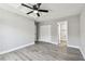 This bedroom features modern gray floors, light gray walls, white trim, closet and access to the bathroom at 3515 41St S Ter # 224, St Petersburg, FL 33711