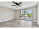 Spacious bedroom with new floors and a sliding door to a balcony overlooking the pool at 3515 41St S Ter # 224, St Petersburg, FL 33711