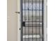 The secured entry door features an ornate, wrought-iron screen, allowing for both safety and ventilation at 3515 41St S Ter # 224, St Petersburg, FL 33711