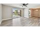 Bright living room with new floors and a sliding door to a balcony overlooking the pool at 3515 41St S Ter # 224, St Petersburg, FL 33711