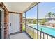 This screened patio offers clear views of the community pool, lounging area, and professionally landscaped green space at 3515 41St S Ter # 224, St Petersburg, FL 33711