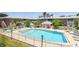 Community swimming pool surrounded by lounge chairs and greenery, perfect for relaxation at 3515 41St S Ter # 224, St Petersburg, FL 33711