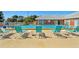Outdoor swimming pool with lounge chairs for relaxation at 3515 41St S Ter # 224, St Petersburg, FL 33711