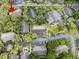 Overhead view of the complex with ample parking spaces and mature trees at 4004 Dream Oak Pl # 102, Tampa, FL 33613