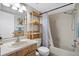 Bathroom with a tub, shower, vanity, and tiled accents at 4004 Dream Oak Pl # 102, Tampa, FL 33613