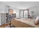 Bright bedroom features a window, bookcase, and minimalist decor at 4004 Dream Oak Pl # 102, Tampa, FL 33613