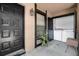 Screened porch includes entry, laundry area with full sized washer dryer, and exterior light fixture at 4004 Dream Oak Pl # 102, Tampa, FL 33613