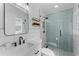 Modern bathroom with glass shower, sleek vanity, and stylish fixtures at 403 Carriage House Ln, Tarpon Springs, FL 34688
