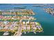 Expansive aerial view showcasing a waterfront property with easy access to both land and sea at 403 Normandy Rd, Madeira Beach, FL 33708