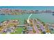 Scenic aerial shot of a waterfront home nestled in a vibrant coastal neighborhood with canal access at 403 Normandy Rd, Madeira Beach, FL 33708