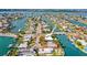 Panoramic aerial view showcasing a waterfront property in a bustling coastal community with boat access at 403 Normandy Rd, Madeira Beach, FL 33708