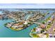 Aerial view of a waterfront community with numerous canals and homes featuring boat docks at 403 Normandy Rd, Madeira Beach, FL 33708