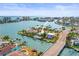 Waterfront property with a private pool and boat dock, situated in a scenic coastal community at 403 Normandy Rd, Madeira Beach, FL 33708