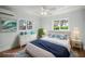 Cozy bedroom featuring a comfortable bed, bright windows and stylish decor at 403 Normandy Rd, Madeira Beach, FL 33708