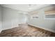 Bright bedroom features hardwood floors and multiple windows at 403 Normandy Rd, Madeira Beach, FL 33708
