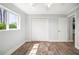 Bedroom with durable floors and large window for natural light, closet for ample storage at 403 Normandy Rd, Madeira Beach, FL 33708