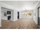 Bright open-concept living room and kitchen with great natural light at 403 Normandy Rd, Madeira Beach, FL 33708