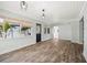 Open-concept living room features natural light and open access to other rooms at 403 Normandy Rd, Madeira Beach, FL 33708