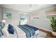 Bright bedroom featuring coastal decor and multiple windows at 403 Normandy Rd, Madeira Beach, FL 33708