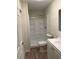 Updated bathroom with a tiled shower and modern fixtures at 5281 Venetian Ne Blvd, St Petersburg, FL 33703