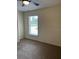 Neutral bedroom with neutral carpet and a window with blinds at 5281 Venetian Ne Blvd, St Petersburg, FL 33703