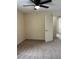 Neutral bedroom featuring a ceiling fan, closet door, and neutral carpet at 5281 Venetian Ne Blvd, St Petersburg, FL 33703