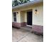 Inviting front entrance with decorative lighting and charming brick accents at 5281 Venetian Ne Blvd, St Petersburg, FL 33703