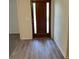 Entryway featuring a wood-look flooring and accent front door at 5281 Venetian Ne Blvd, St Petersburg, FL 33703