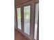 Exterior glass doors showing the screened patio and exterior area at 5281 Venetian Ne Blvd, St Petersburg, FL 33703