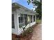 Exterior view of the enclosed patio with access to the backyard at 5281 Venetian Ne Blvd, St Petersburg, FL 33703