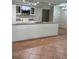 Kitchen featuring a large granite island countertop and stainless steel appliances at 5281 Venetian Ne Blvd, St Petersburg, FL 33703