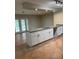 Kitchen featuring large island, white cabinets, granite countertops, and stainless steel faucet at 5281 Venetian Ne Blvd, St Petersburg, FL 33703