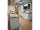 Bright kitchen with a tile floor, granite countertops, and stainless appliances at 5281 Venetian Ne Blvd, St Petersburg, FL 33703