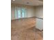 Spacious living room with tile floors and sliding glass doors leading to the outdoors at 5281 Venetian Ne Blvd, St Petersburg, FL 33703