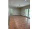 Open-plan living room featuring tiled floor and sliding patio doors for lots of natural light at 5281 Venetian Ne Blvd, St Petersburg, FL 33703