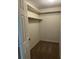 Walk-in closet with carpet flooring and shelving at 5281 Venetian Ne Blvd, St Petersburg, FL 33703