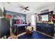Stylish bedroom with dark wood furniture, area rug, and a baseball theme throughout at 5457 Sandy Shell Dr, Apollo Beach, FL 33572