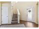 Grand foyer with tiled floors, staircase, and a decorative front door at 5457 Sandy Shell Dr, Apollo Beach, FL 33572