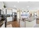 Modern kitchen featuring granite countertops, stainless steel appliances, and an island with sink at 5457 Sandy Shell Dr, Apollo Beach, FL 33572