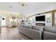 Inviting living room showcasing stylish decor, fireplace, and ample natural light at 5457 Sandy Shell Dr, Apollo Beach, FL 33572