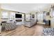 Inviting living room showcasing stylish decor, fireplace, and ample natural light at 5457 Sandy Shell Dr, Apollo Beach, FL 33572