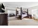 Spacious main bedroom features a four-poster bed, seating area, and lots of natural light at 5457 Sandy Shell Dr, Apollo Beach, FL 33572